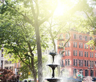 Fountain on a summer day at Madison Square park in Mid town Manhattan.