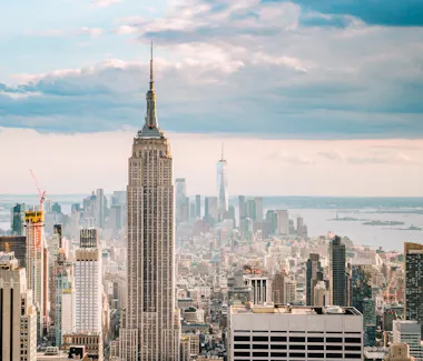 Empire state building with a bright blue sky backdrop