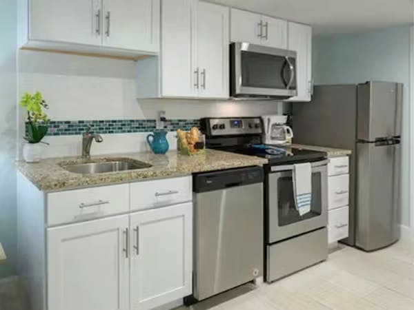 Grand Seas Resort - Daytona Beach, FL, beach resort w/ spacious accommodations, living area, kitchen, & oceanfront views.