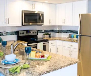 Grand Seas Resort - Daytona Beach, FL, beach resort w/ spacious accommodations, living area, kitchen, & oceanfront views.