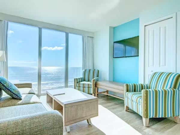 Grand Seas Resort - Daytona Beach, FL, beach resort w/ spacious accommodations, living area, kitchen, & oceanfront views.