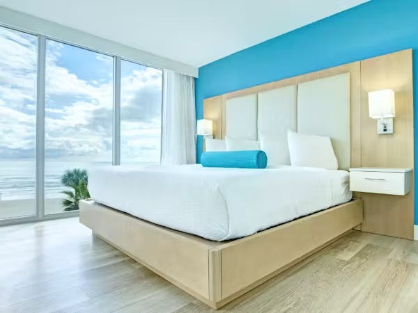 Grand Seas Resort - Daytona Beach, FL, beach resort w/ spacious accommodations, living area, kitchen, & oceanfront views.