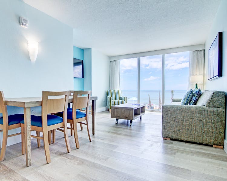 Grand Seas Resort - Daytona Beach, FL, beach resort w/ spacious accommodations, living area, & oceanfront views.