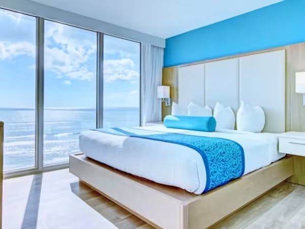Grand Seas Resort - Daytona Beach, FL, beach resort w/ spacious accommodations, living area, kitchen, & oceanfront views.