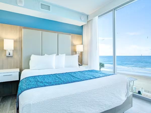 Grand Seas Resort - Daytona Beach, FL, beach resort w/ spacious accommodations, living area, kitchen, & oceanfront views.