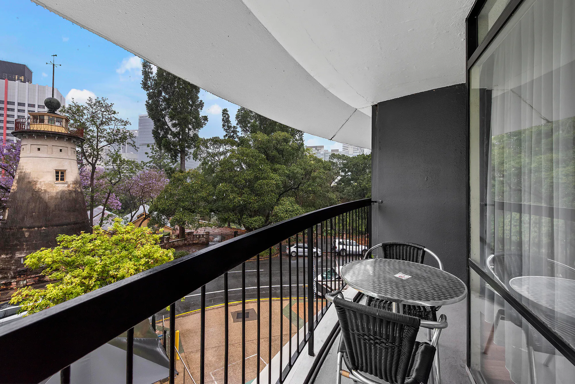 View of surrounding gardens from Family Room balcony at the Tower Mill Hotel Brisbane