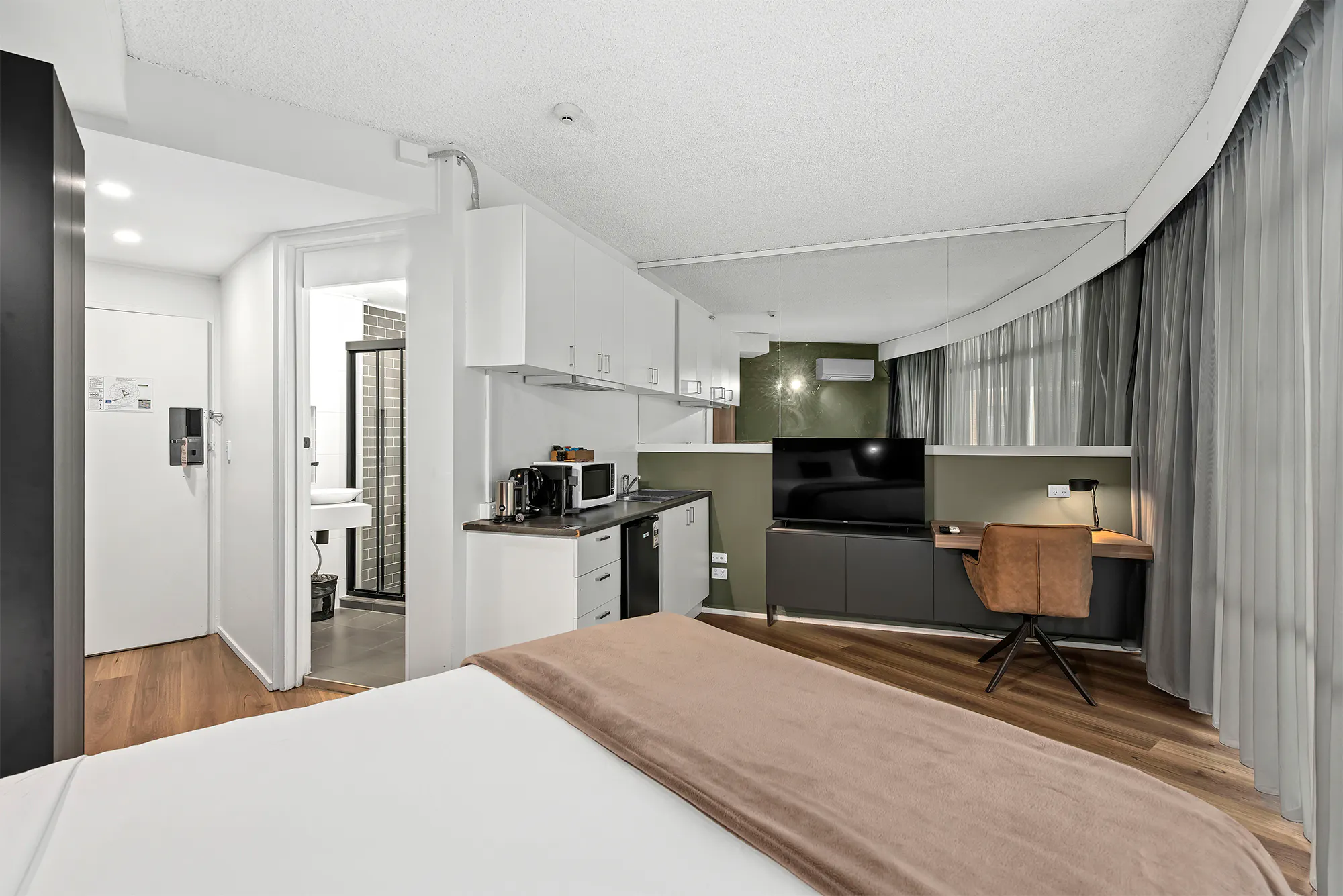 Tower Mill Hotel Brisbane queen room with kitchenette and work desk