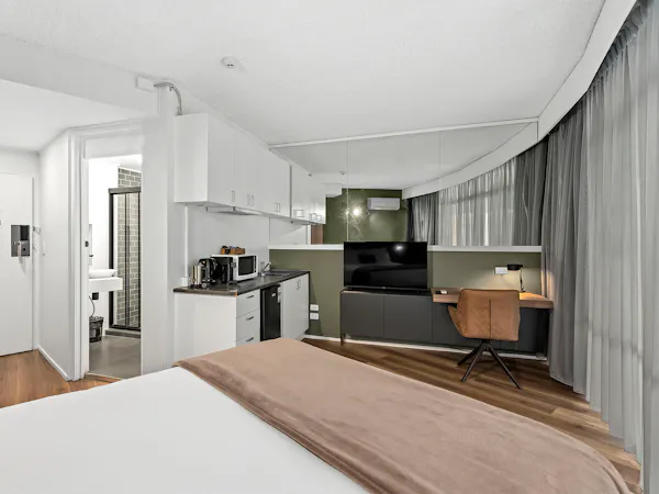 Tower Mill Hotel Brisbane queen room with kitchenette and work desk