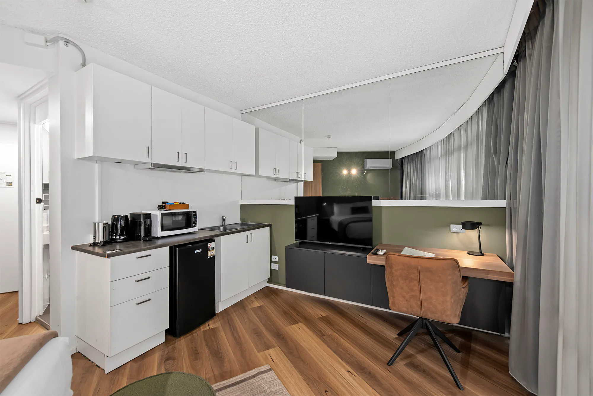 Kitchenette facilities and work desk in a Queen room at the Tower Mill Hotel