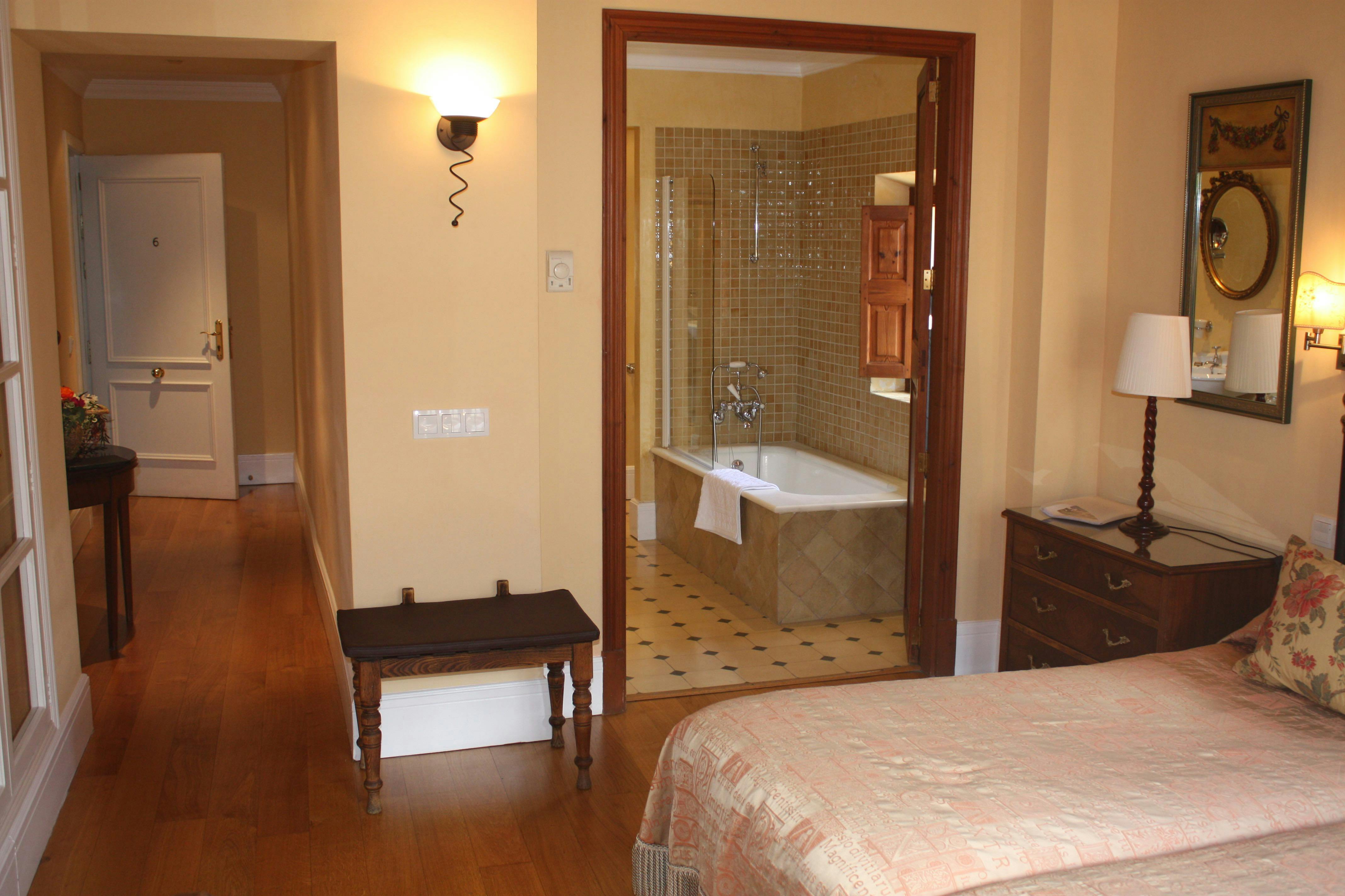 The orange twin room with view of the bathroom