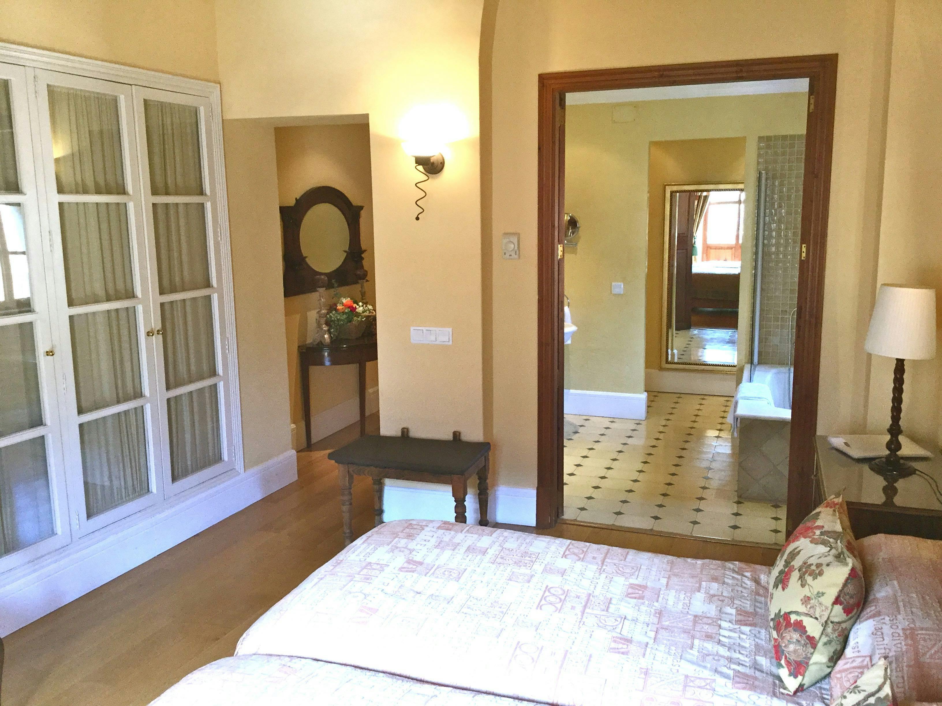 The orange twin room with view of the bathroom