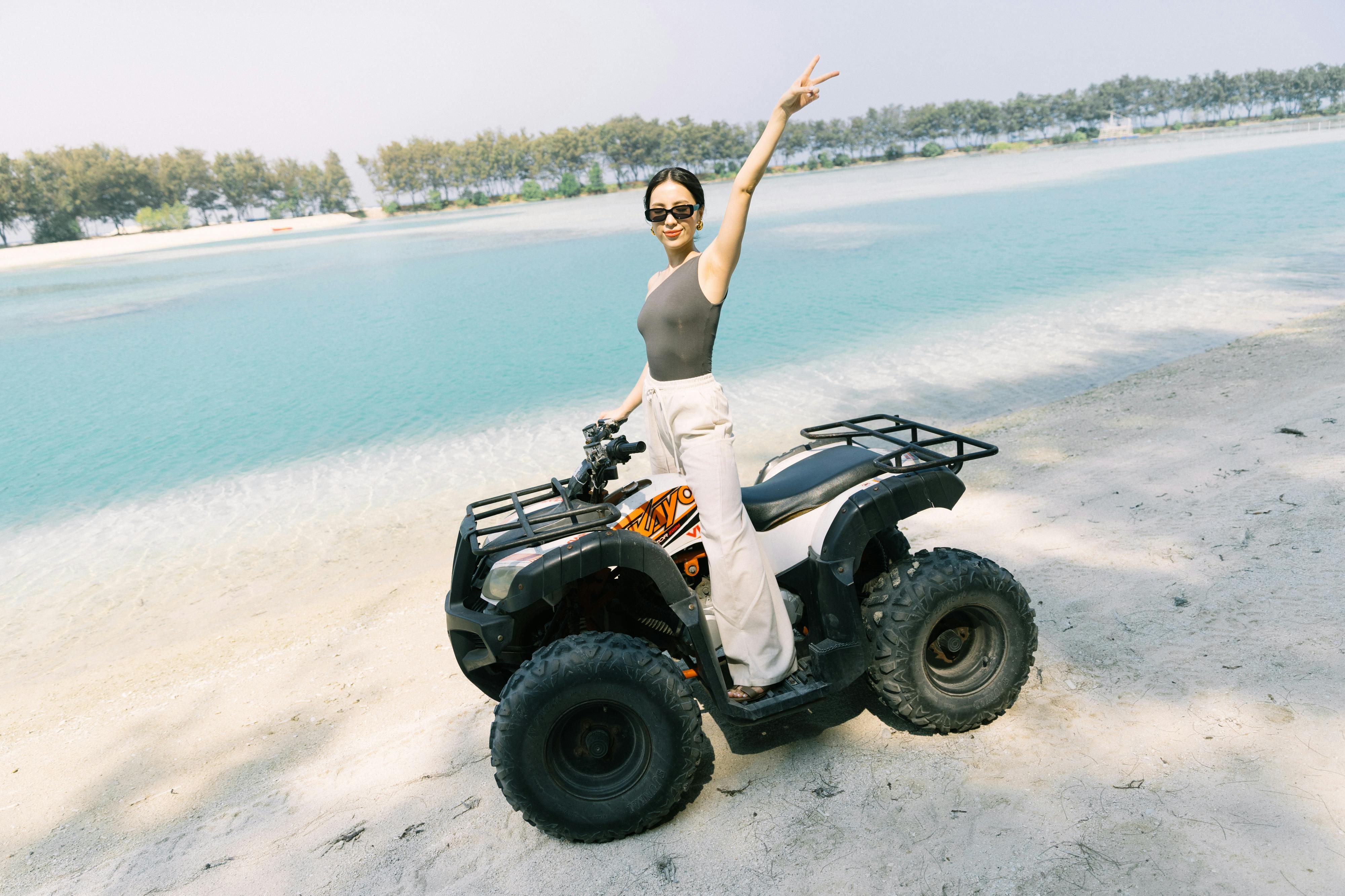 Girl riding an ATV on Pulau Payung in Thousand Islands
