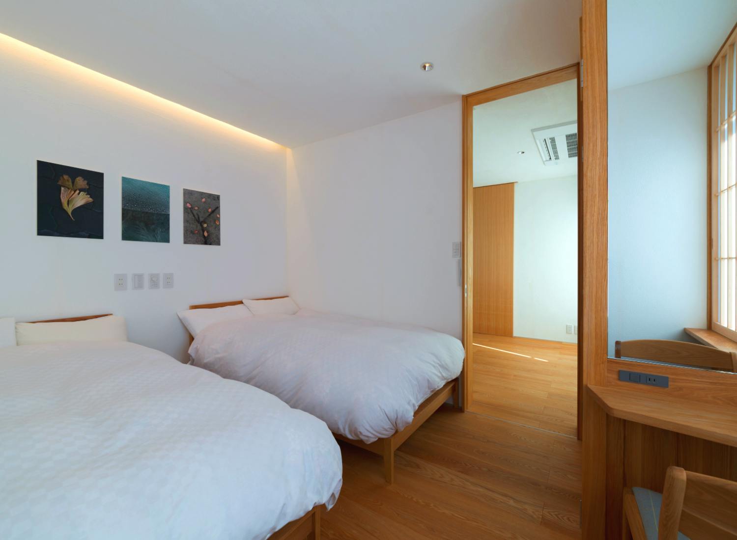 Kyoto Komatsu Residences - Western bedroom with photos by John Einarsen of Kyoto Journal