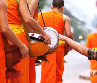 Alms giving Villa Maly Luang Prabang