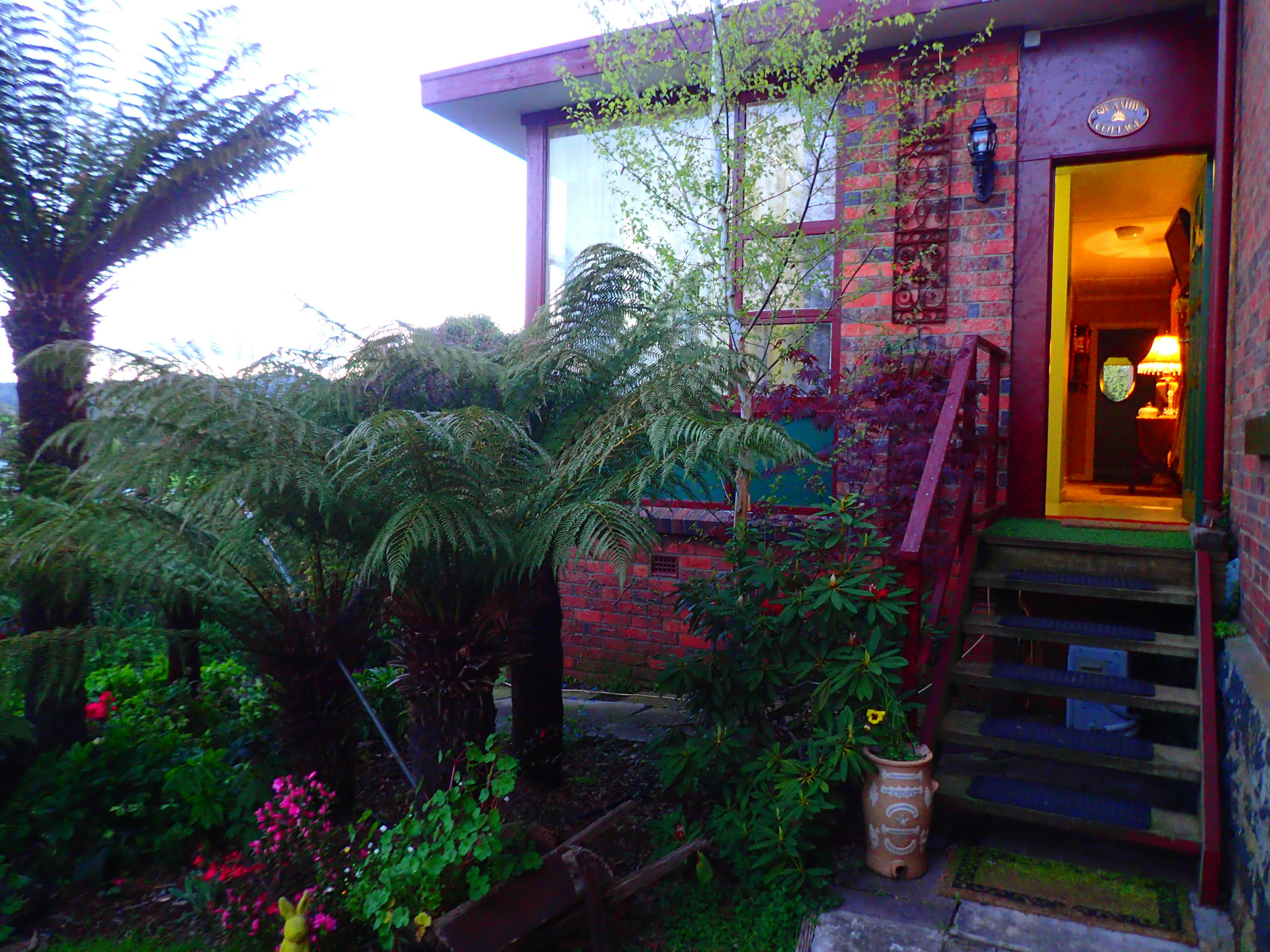 Lush gardens leading to Blakes Manors Garden Suite