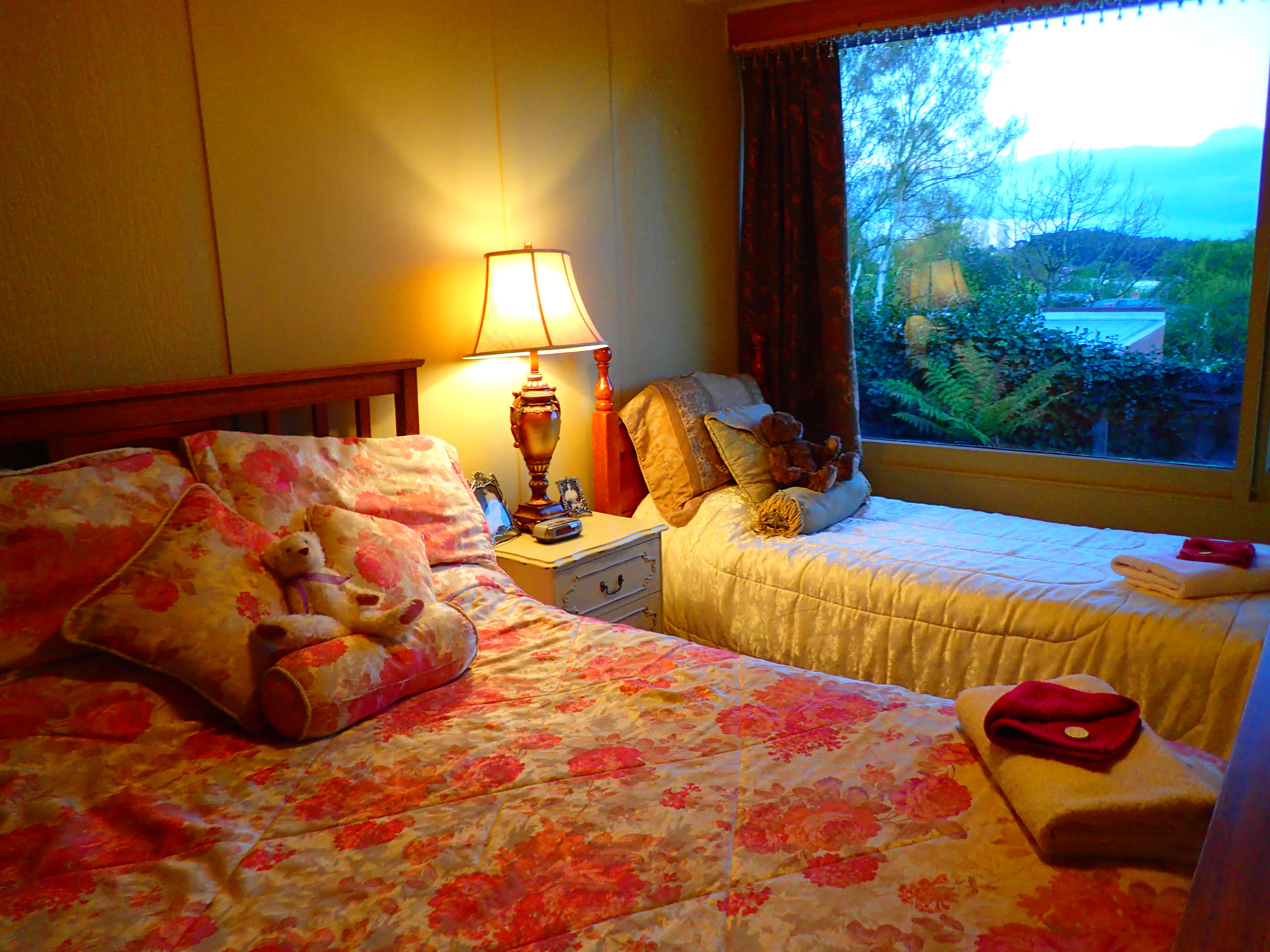 Warm and cosy second bedroom features double and single beds.A great place to stay while at Historic Blakes Manor.