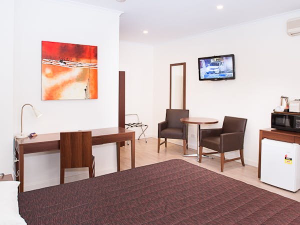 Experience a restful stay in our modern room equipped with everything you need for work and relaxation.