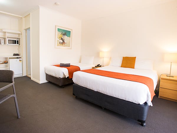 Comfortable room: 1 double, 1 single bed, amenities for small groups/families.