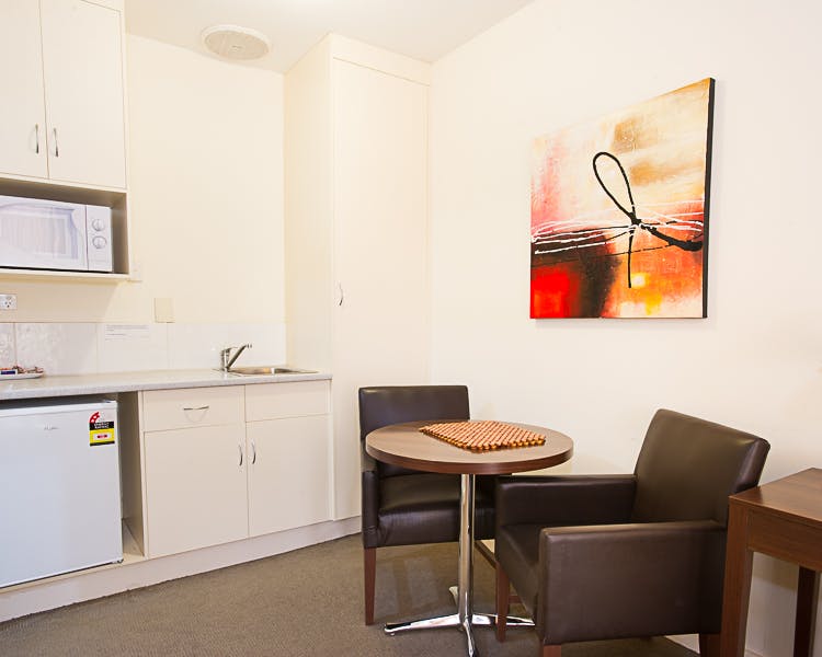 Simple studio with kitchenette & art.