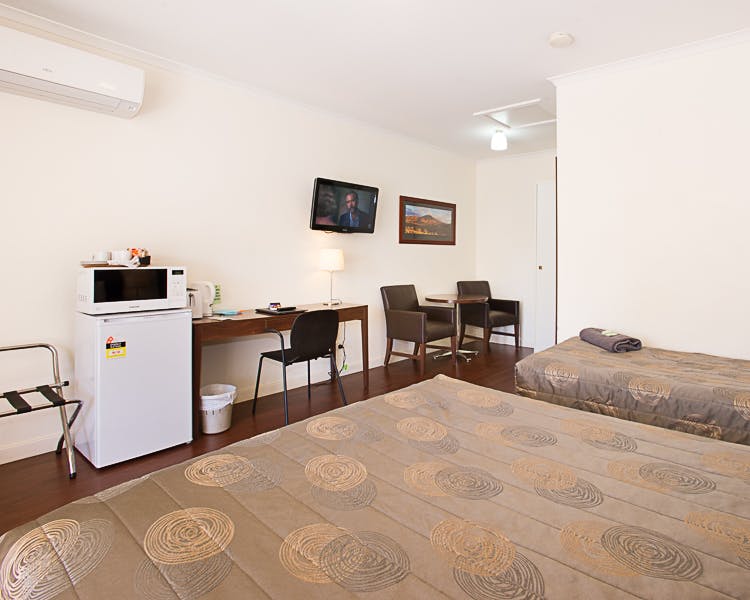 Clean, simple room. 1 double, 1 single bed. Microwave, TV, AC. Budget stay.