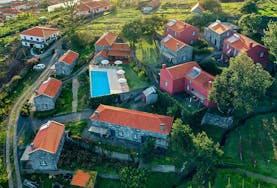 Arial view of Mezaine Cottages Suites, Apartment Cottage Suites, Casa Balanco and outdoor swimming pool at Quinta das Vinhas.