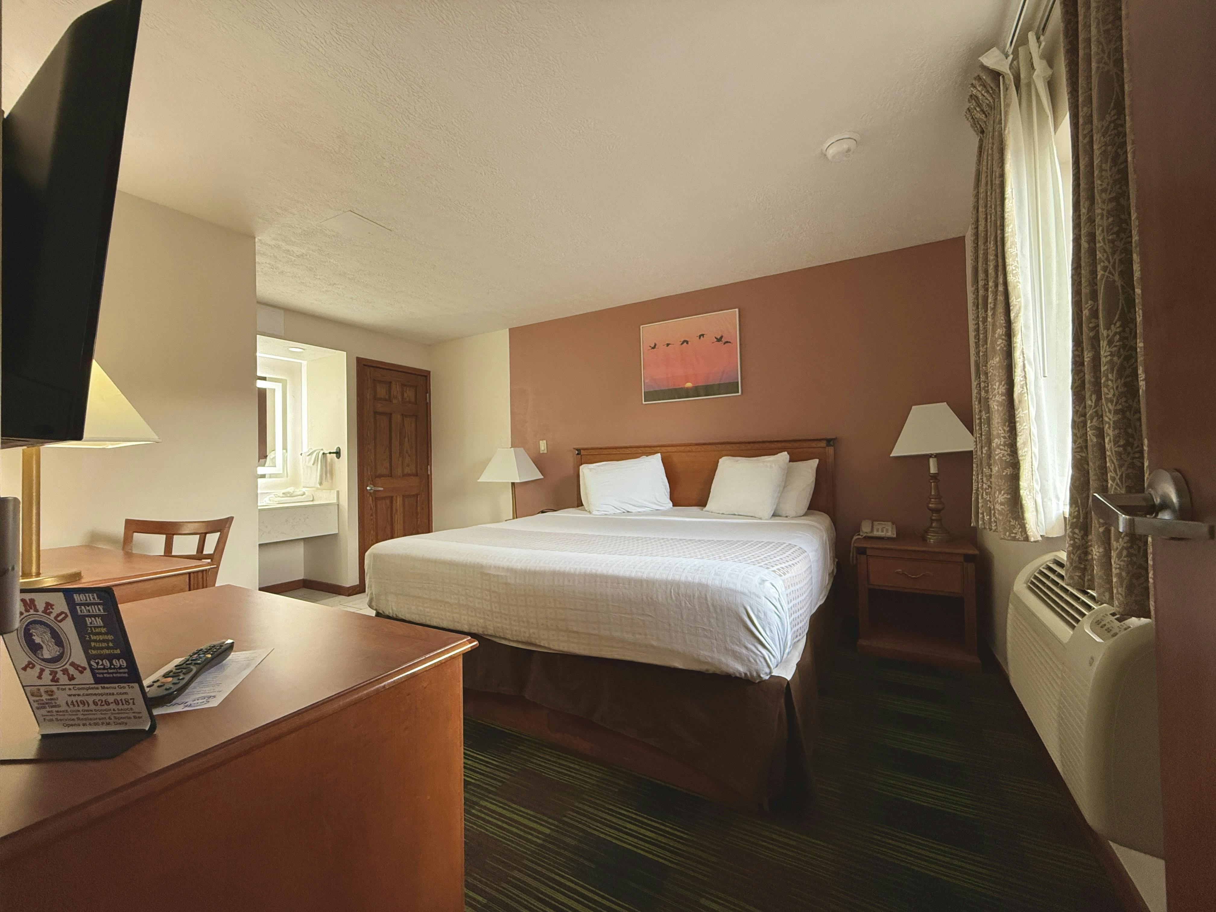 comfortable king bed in a Suite, South Shore Inn Sandusky