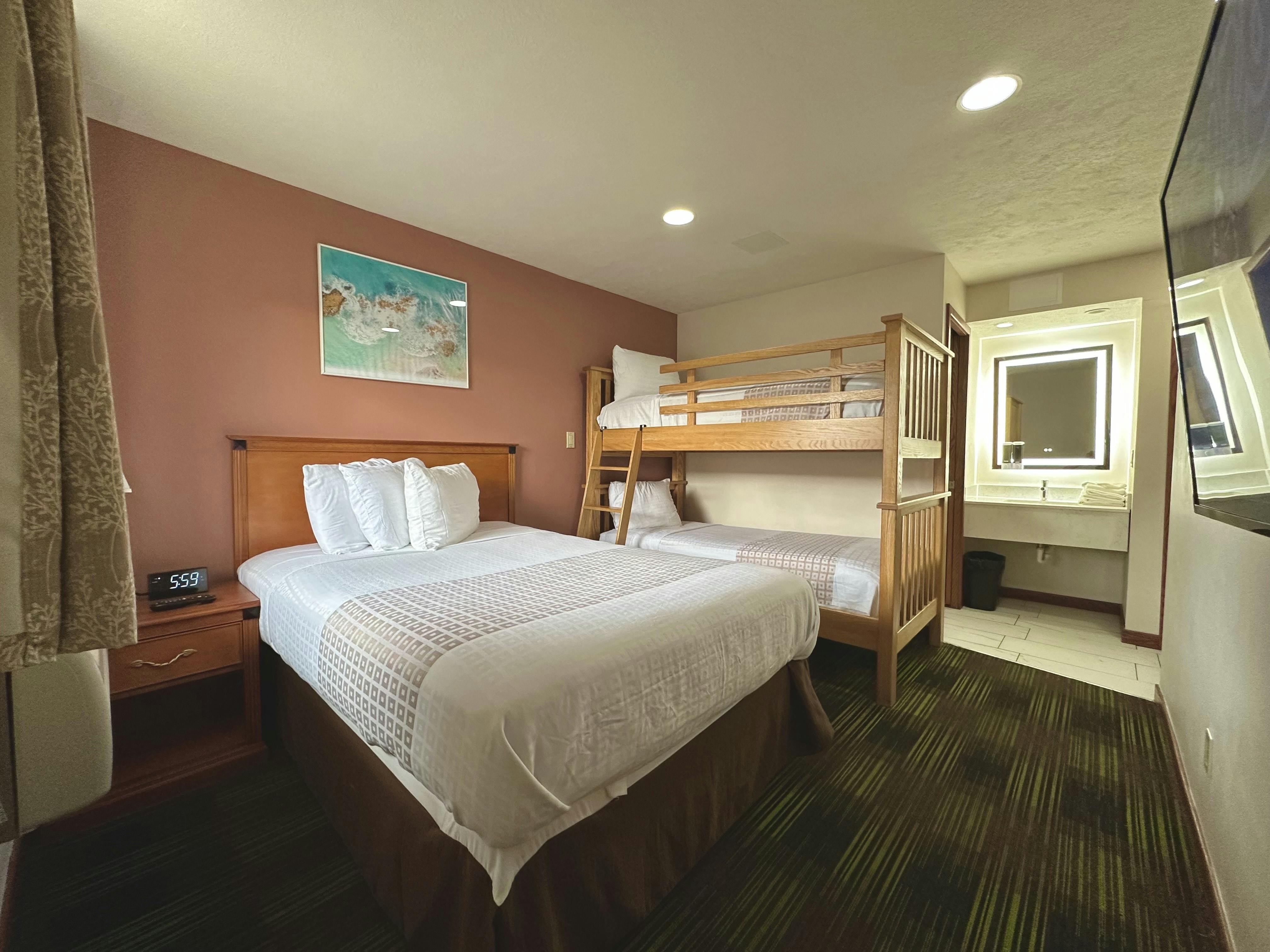 Full bed and Bunk bed in three room suite with bunks perfect for large families at South Shore Inn Sandusky