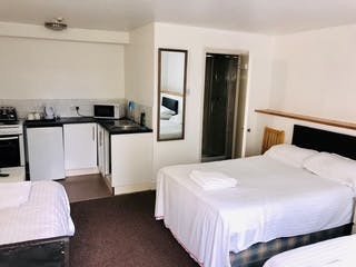 Triple Self Contained room with small kitchenette and En-suite Shower.