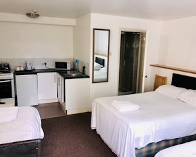 Triple Self Contained room with small kitchenette and En-suite Shower.