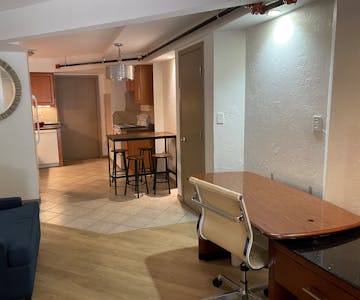 Standard Suite Type 11 living room at WangShi Palace — spacious seating area with TV and balcony access.