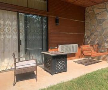 Ground-level patio with fire pit and outdoor seating