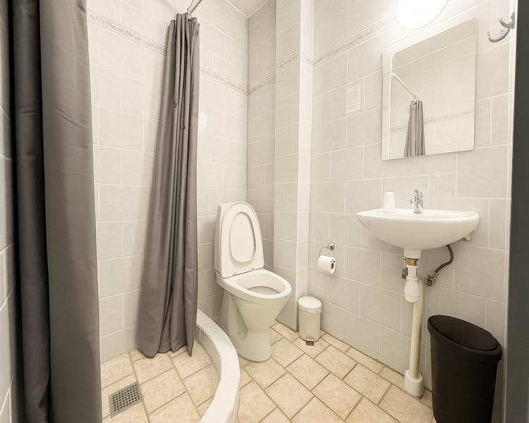 "Spacious bathroom with rainfall shower and twin sinks