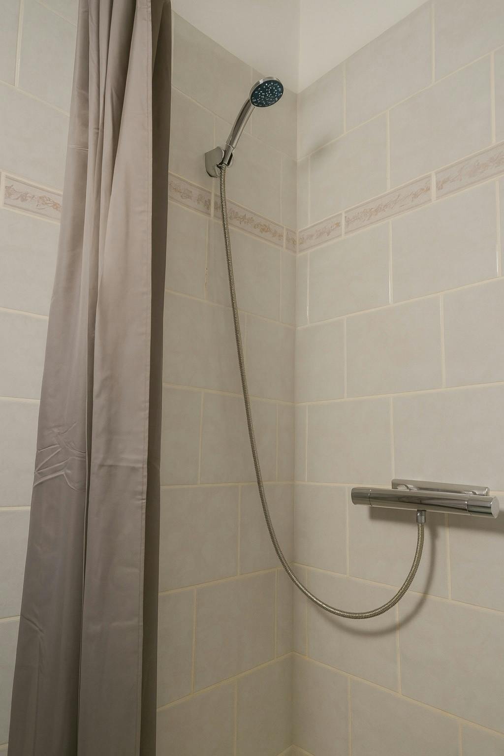 Clean private shower in Hotel Amager single room bathroom, Copenhagen affordable rates