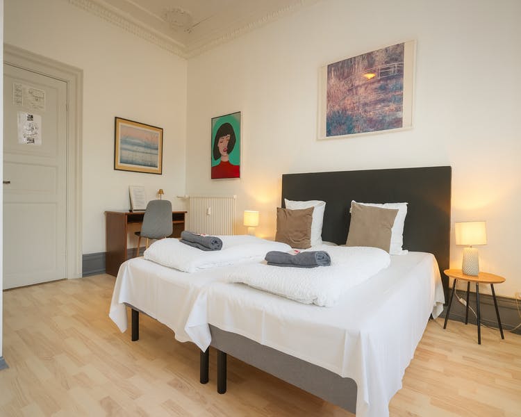 Modern double room with queen bed and city view at Hotel Amager