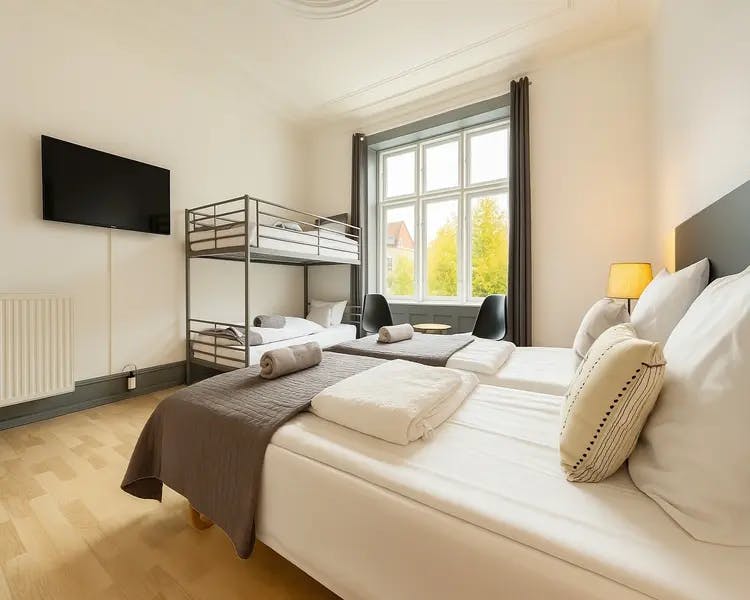 Modern double and familly room with queen bed and city view at Hotel Amager copenhagen