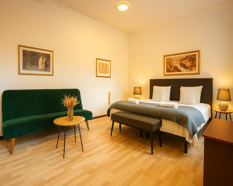 Modern double room with queen bed and city view at Hotel Amager