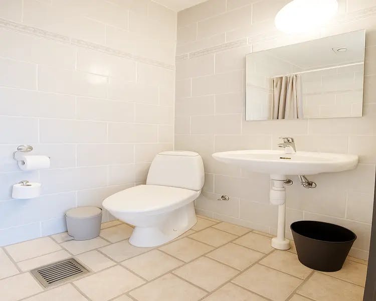 Spacious bathroom with rainfall shower and twin sinks