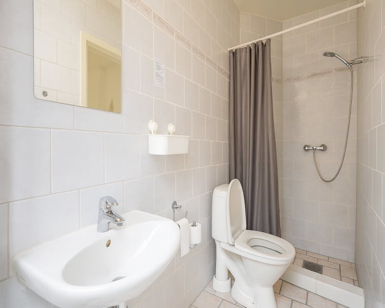 Spacious bathroom with rainfall shower and twin sinks