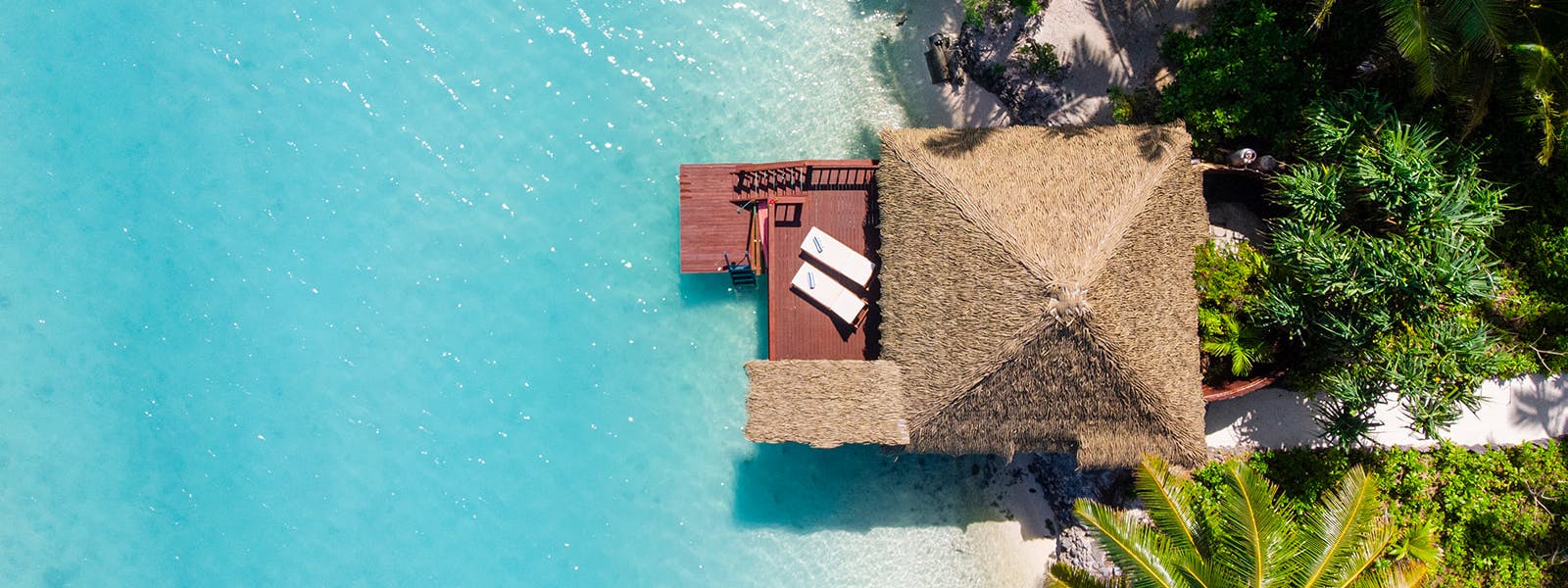 Overwater bungalow with private deck overlooking Aitutaki Lagoon Accommodation Cook Islands Aitutaki