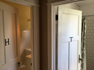 Entry doorways into two private upstairs bathrooms