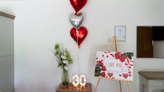 Celebration package for birthdays, anniversaries and just romantic stays in general. Balloons and petals, 'personal signs'