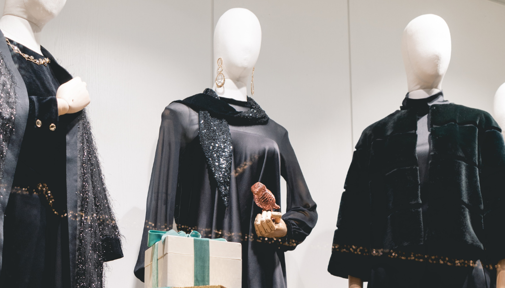 Window display of designer clothes. Festive with gift wrapper