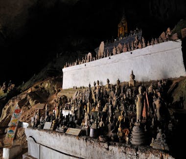 Wooden buddha statues Pak Ou caves Luang Prabang