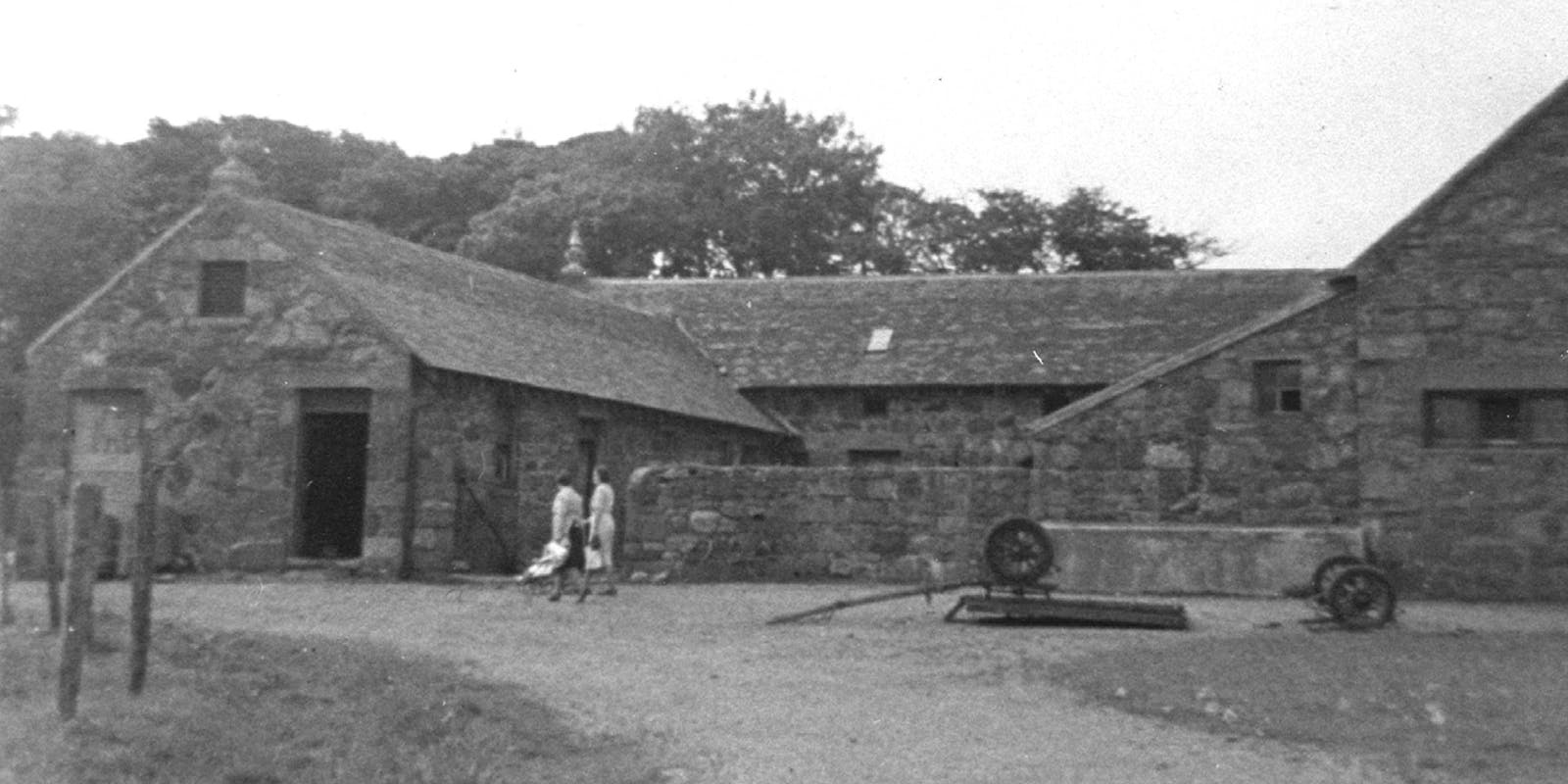 Vintage black and white image of a barn at Manor Farm stables, Isle of Lewis, highlighting its rustic charm.