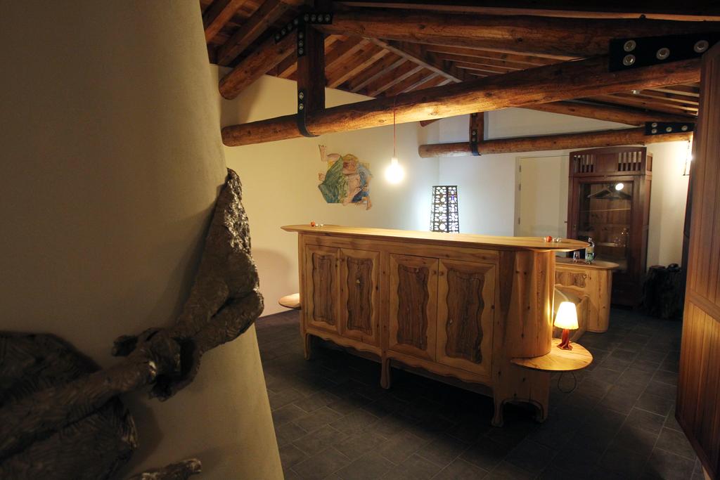 Junior Suite Asidos, chimney and bed