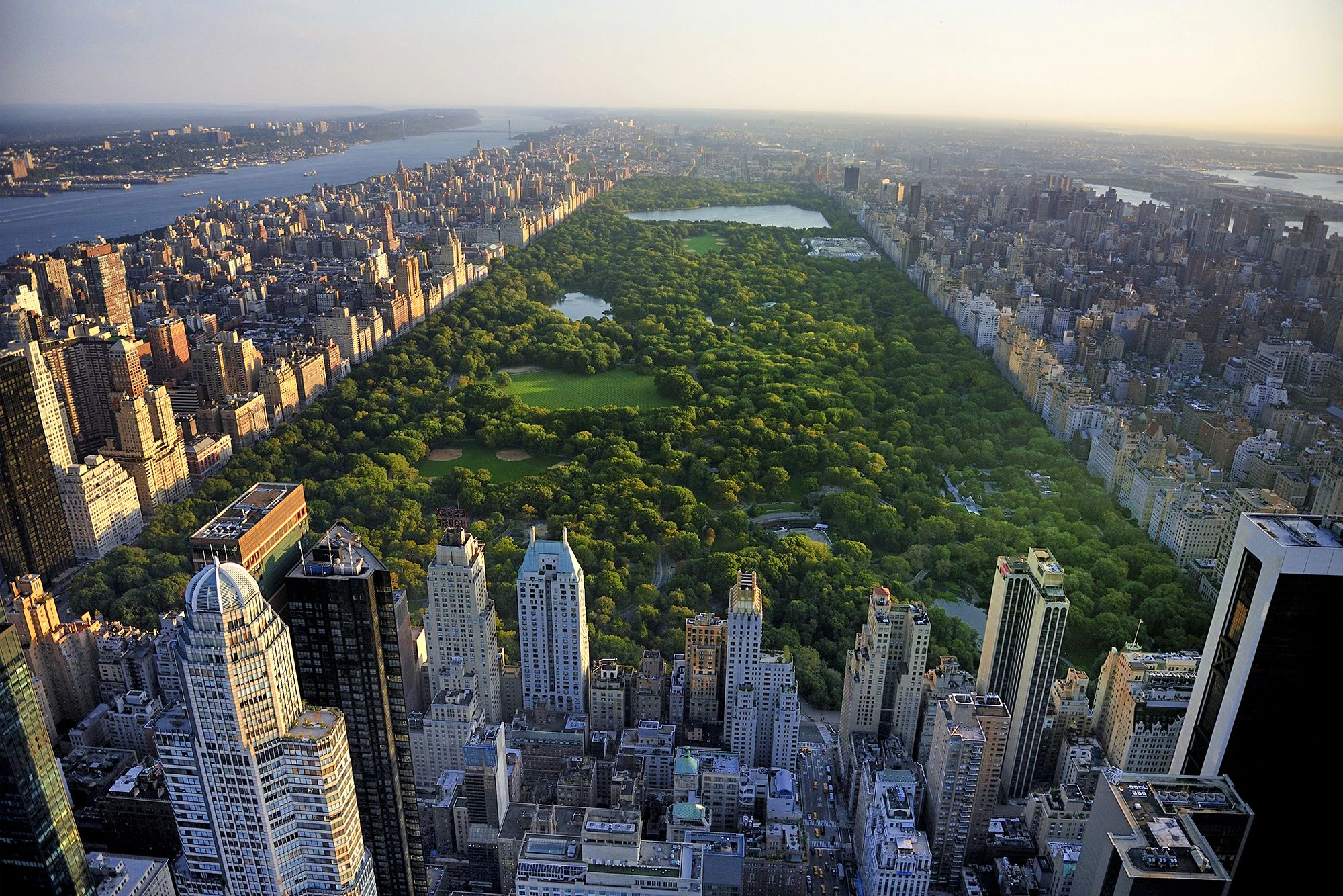 Aerial view of Central Park surrounded by skyscrapers and buildings in New York City