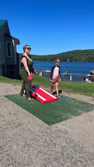 Family Fun at Dayspring Cottages - Mom and Son Playing Cornhole Together
