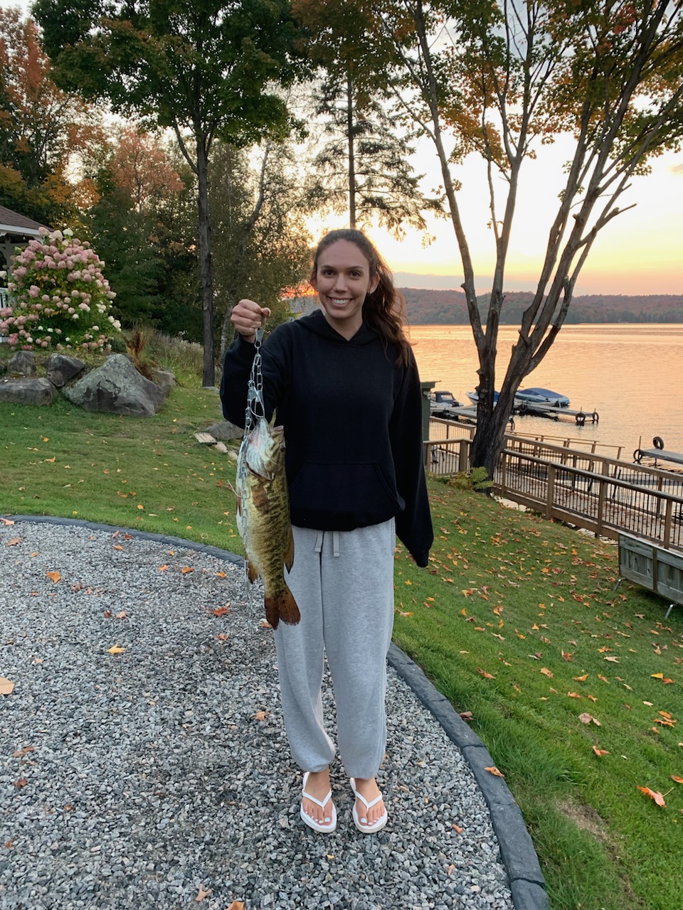 Kid-Friendly Fishing Cottages in Ontario - Girl Holding a Fish at DaySpring Cottages