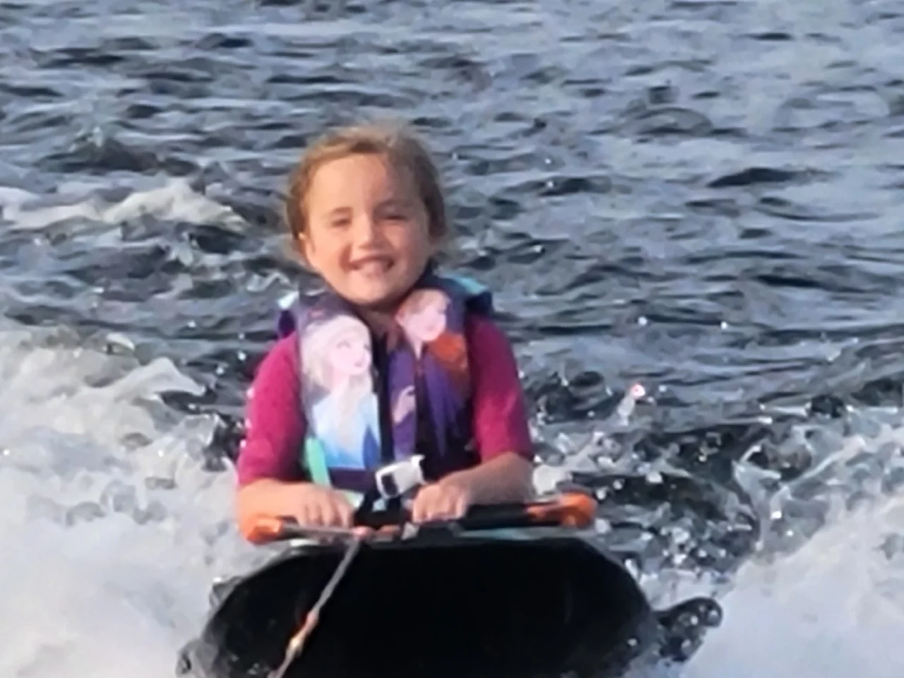 Kid-Friendly Water Activities at Doe Lake - Little Girl Knee Boarding with Dayspring Cottages Experience"