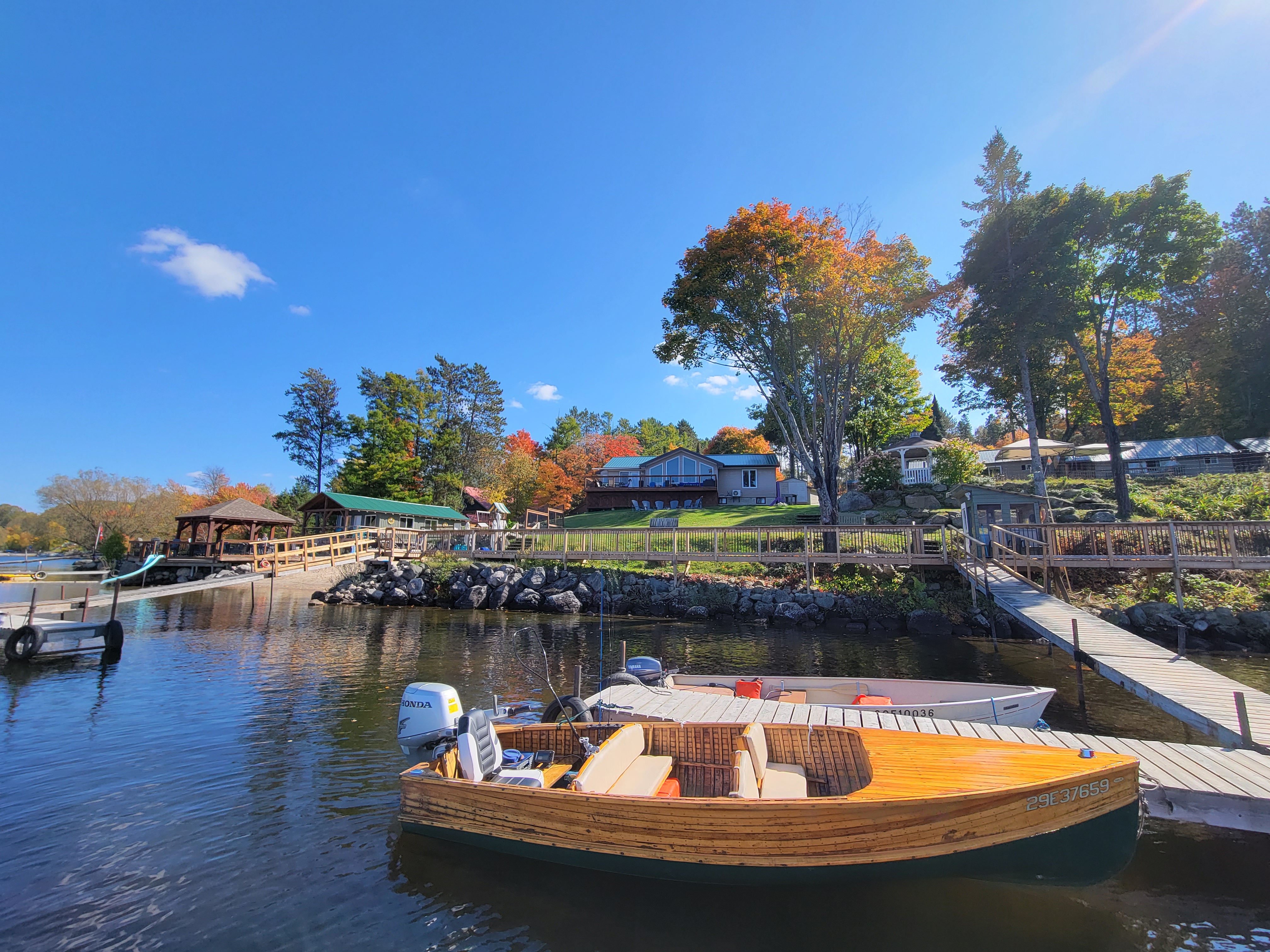 Yellow boat on the water with a view of Dayspring Cottages property in the background